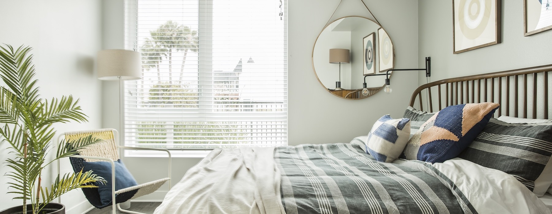 a bedroom with a bed and chair