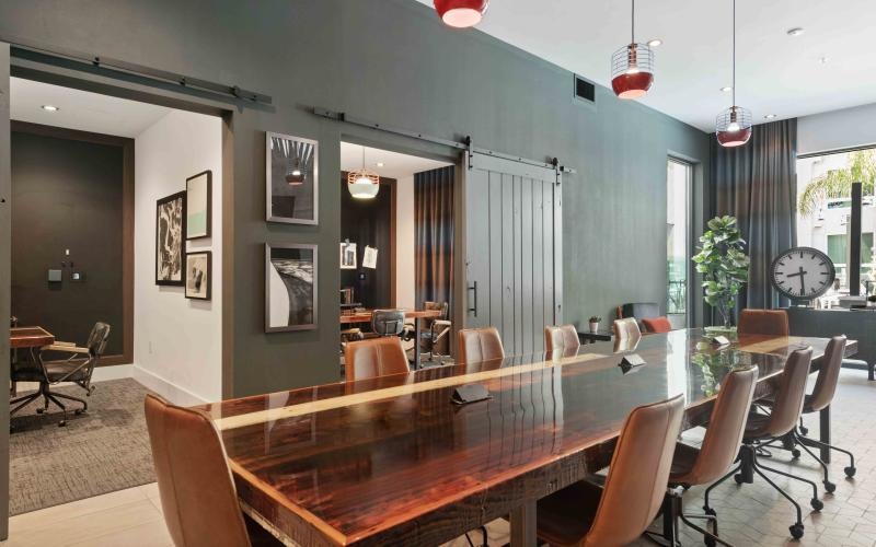 a clubroom with tables and chairs