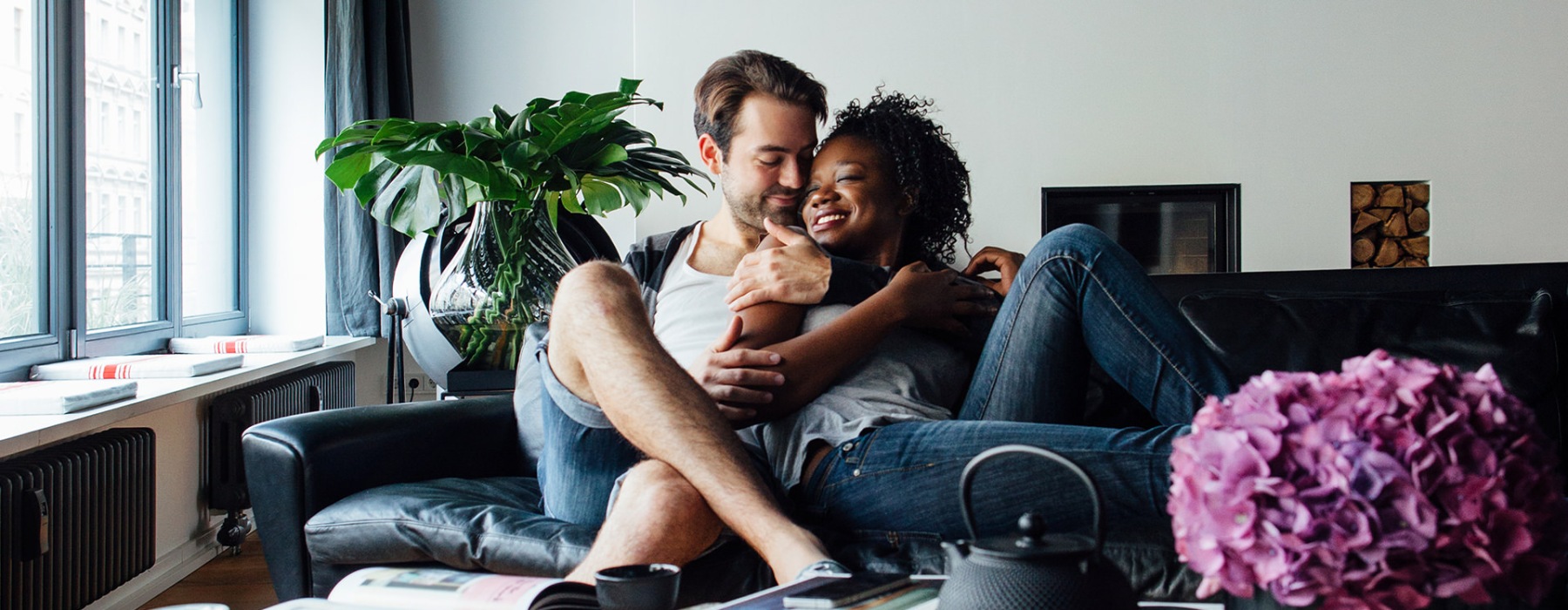 a man and woman sitting on a couch